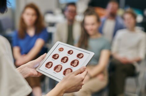 Pregnant women in a class