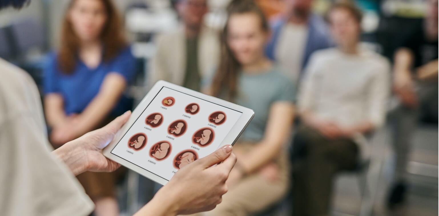 A group of pregnant women in a class setting
