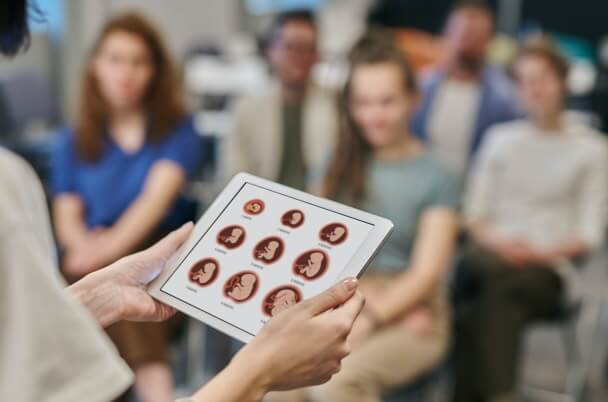 Pregnant women in a class